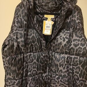 Michael Kors charcoal gray leopard print hooded quilted down jacket.